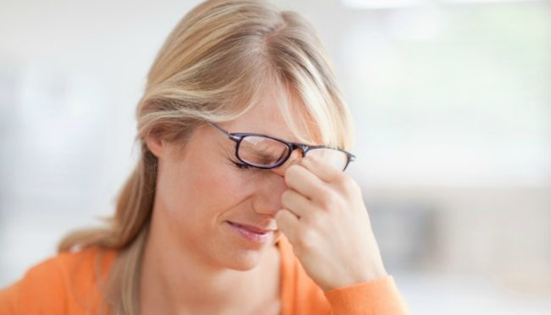 woman is stressed with her hand to her forhead