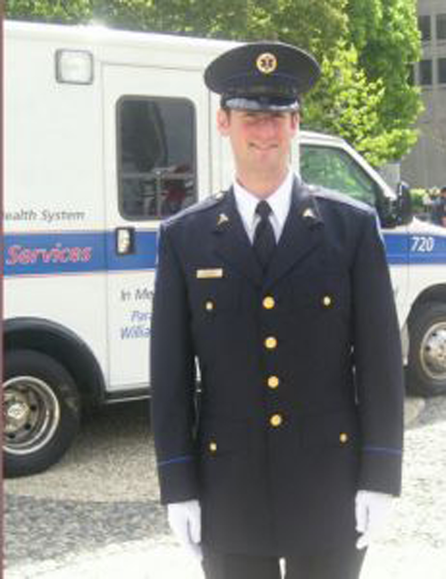 man in uniform in front of an amulance