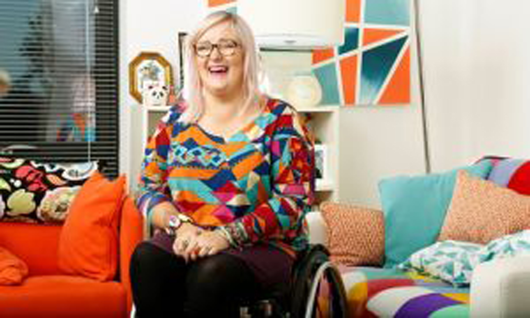 a woman in a wheelchair smiling