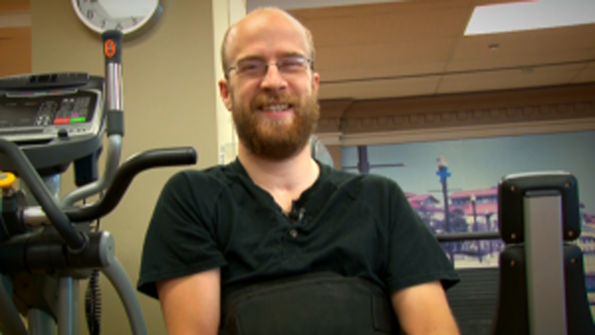 man smiles at the camera