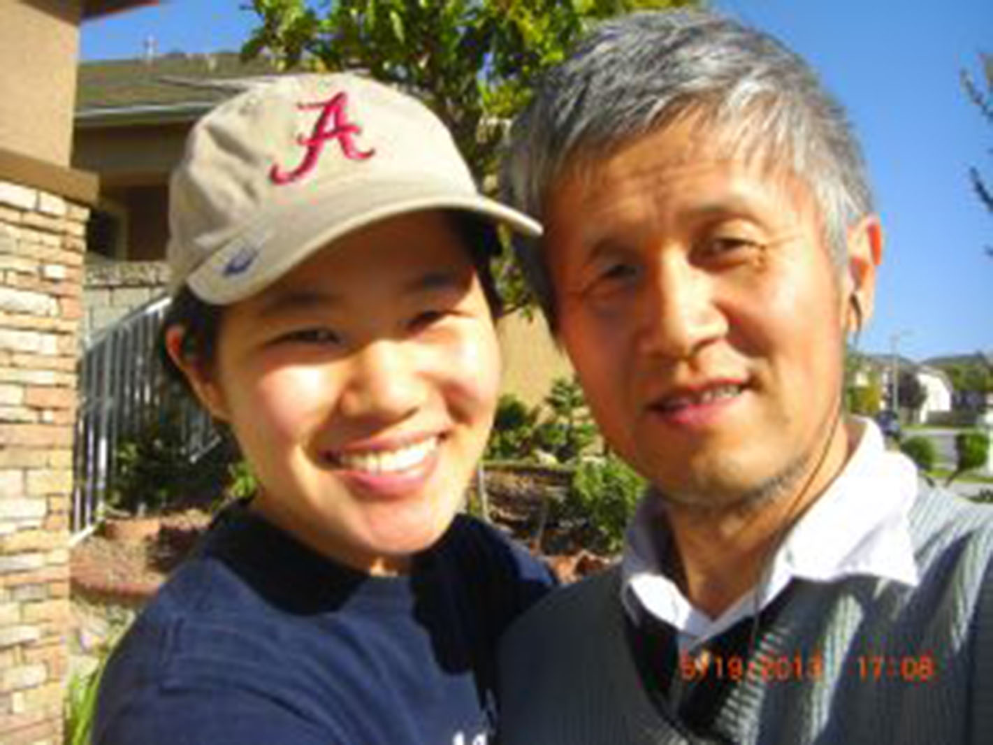 closeup of a father and daughter smiling
