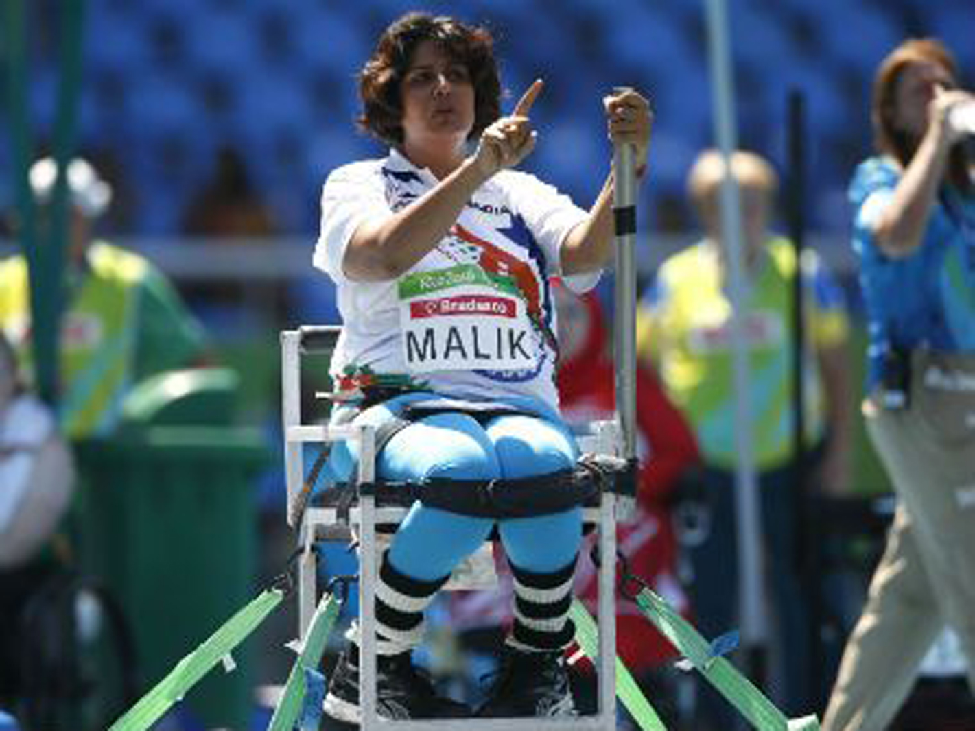 a woman in a specialized sports wheelchair