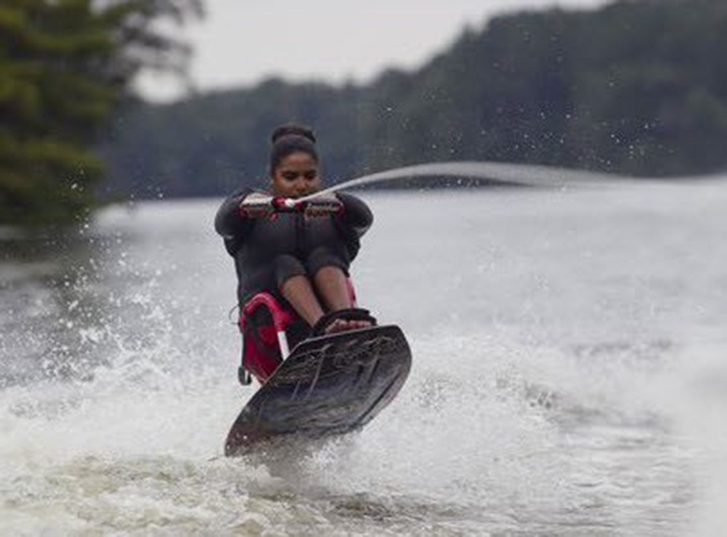 Paraplegic woman wakeboarding