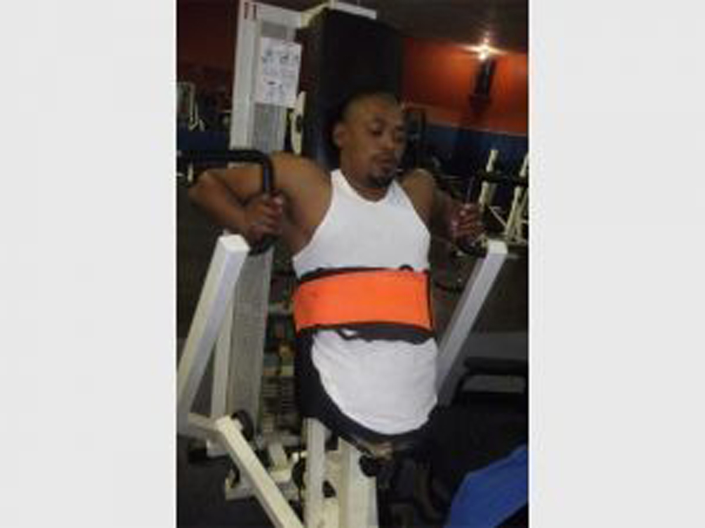 man without legs exercising on gym equipment
