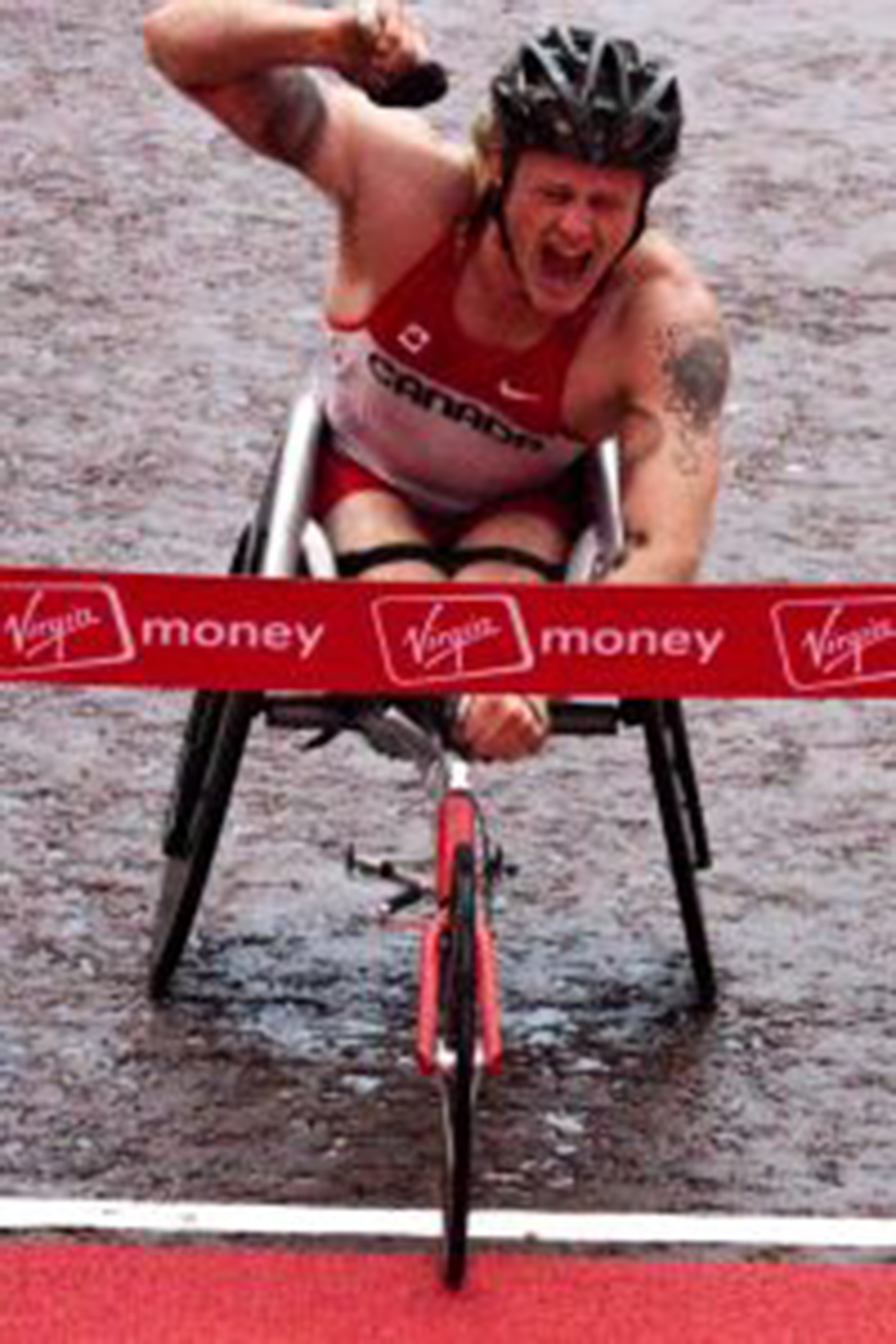 Wheelchair racer crossing the finish line
