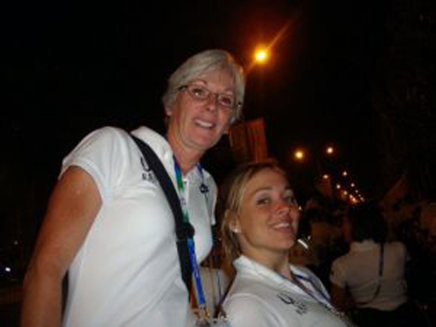 quadriplegic woman and another woman standing with her