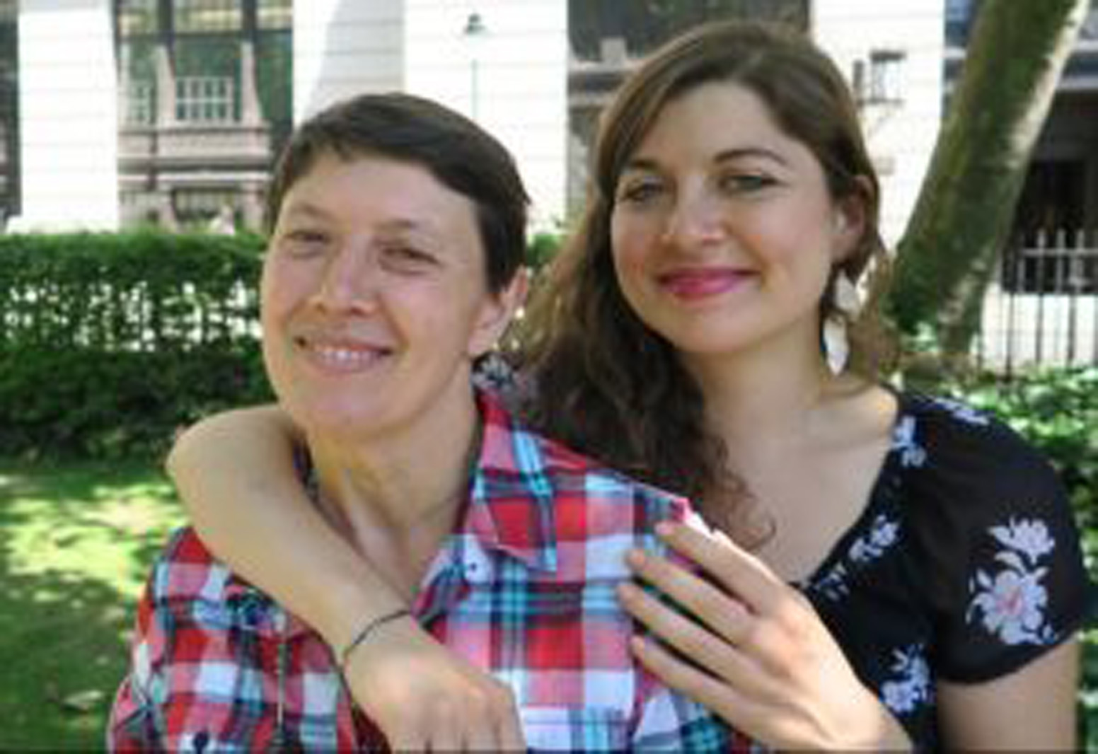 a mom and daughter smiling