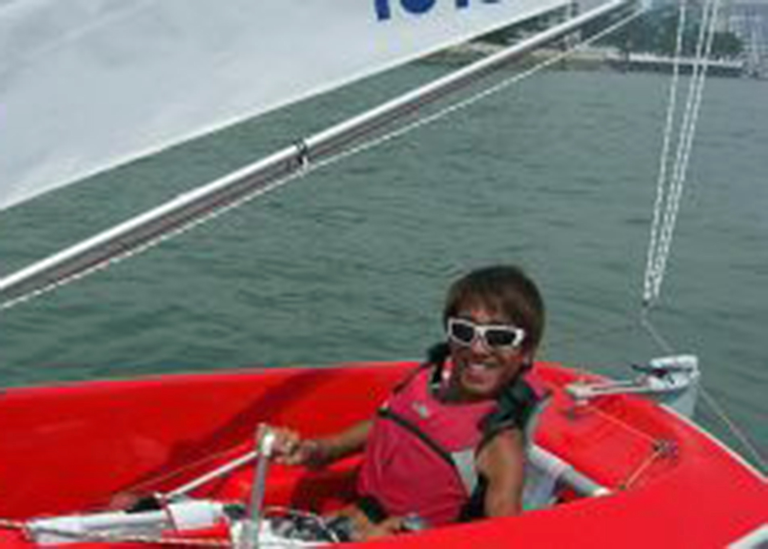 man sits in a sailboat