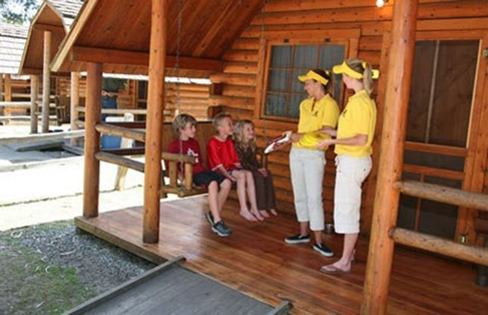 people in front of a cabin