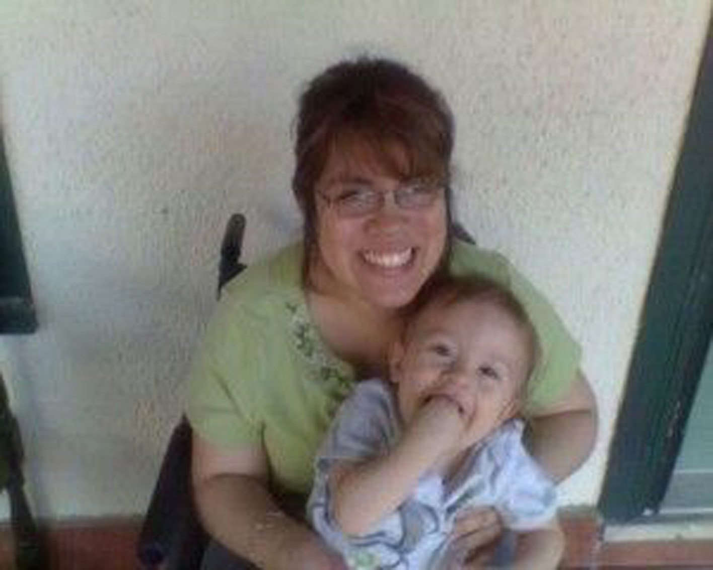 mom in a wheelchair holding her baby