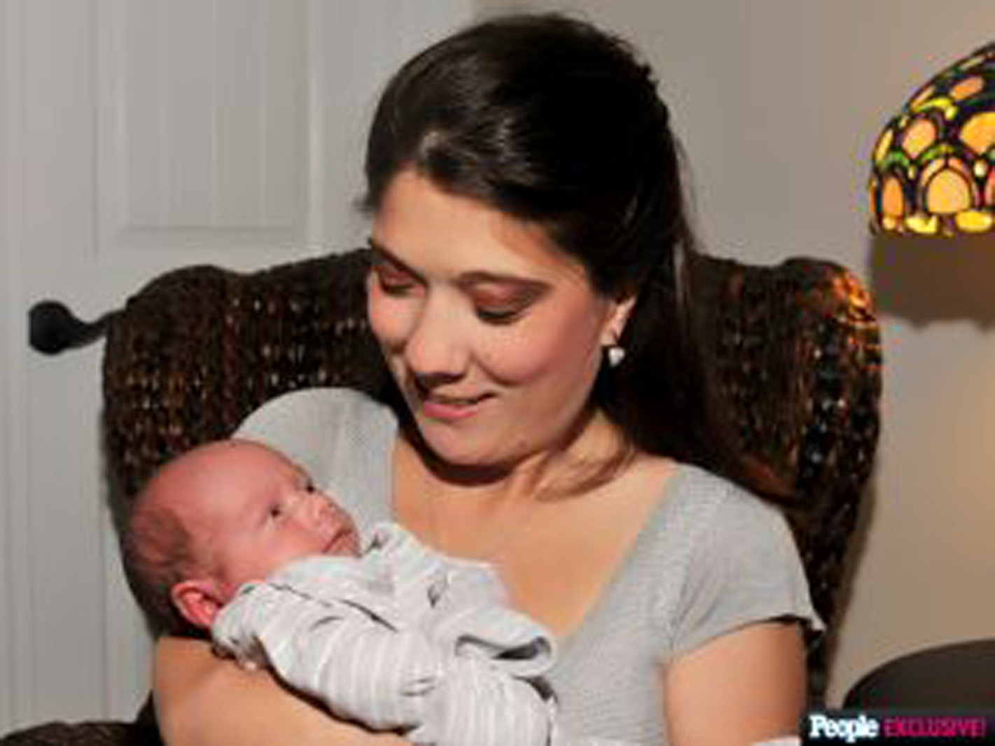 mom holding her infant baby