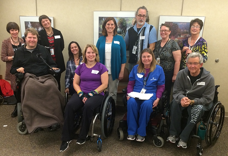 Lindsey Elliott, peer group program coordinator (center) with members of United Spinal’s Minnesota chapter.
