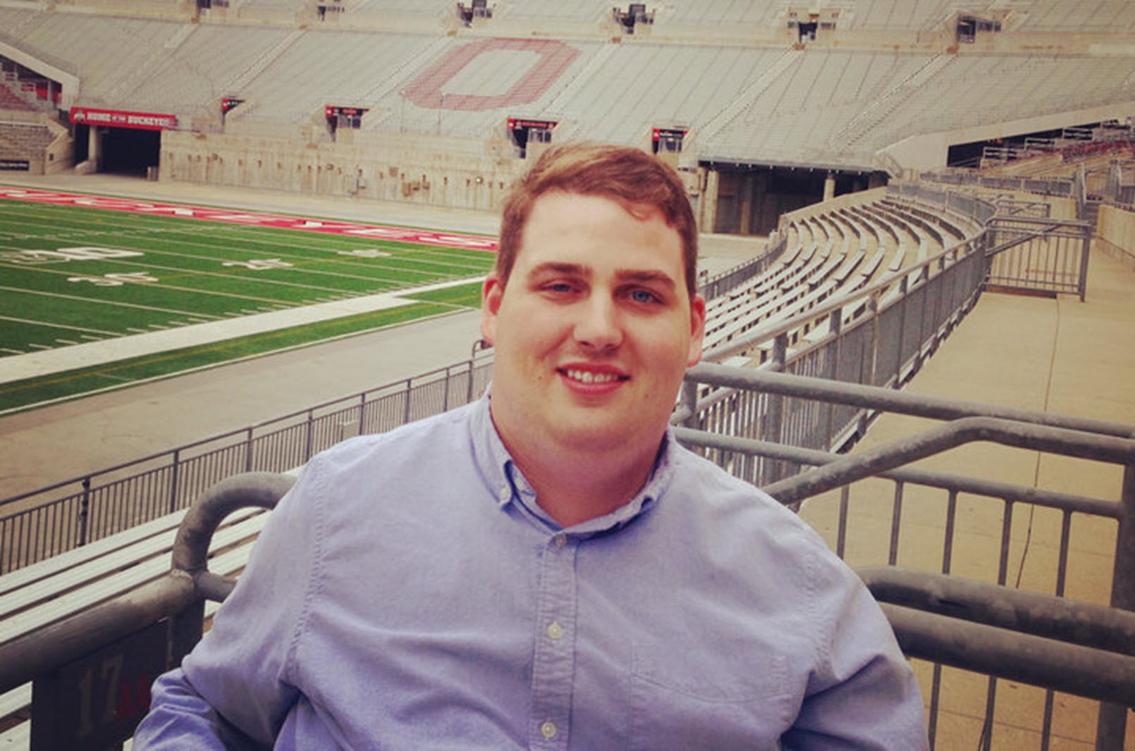 quadriplegic man sits in a football stadium