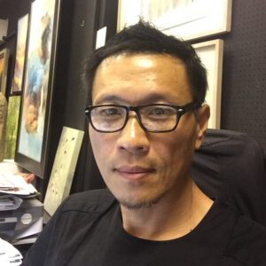 man sits in a chair in his office