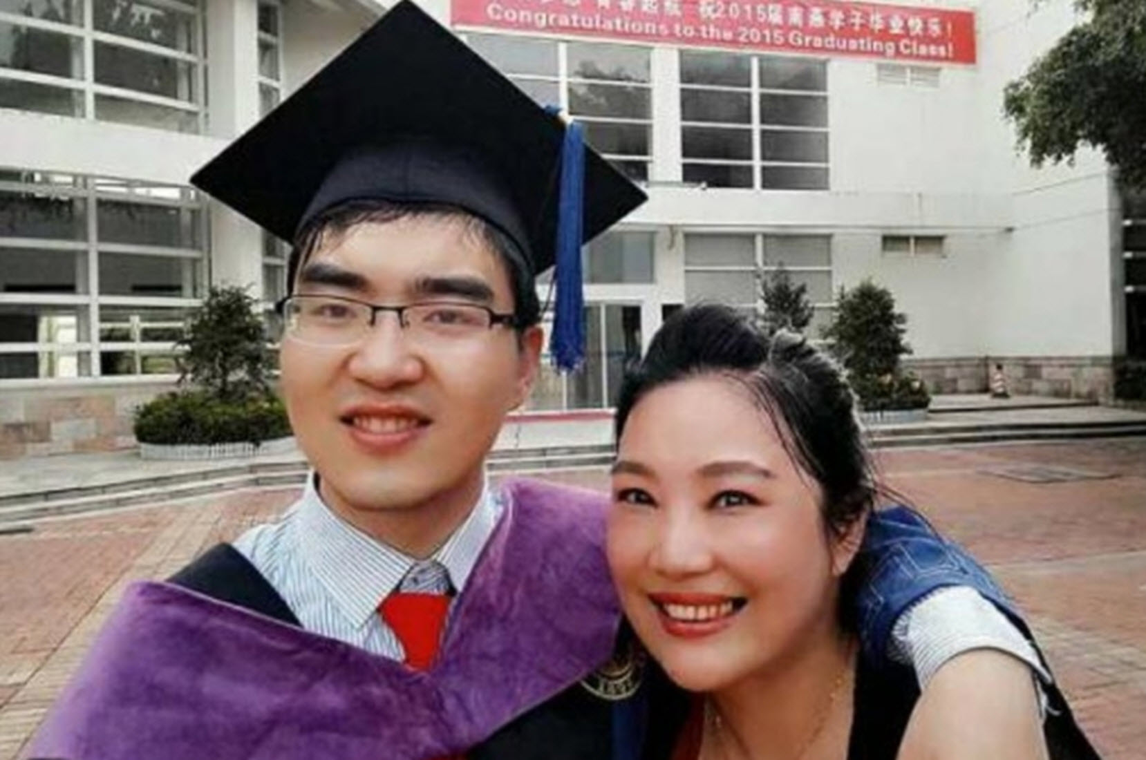 a college graduate with cerebral palsy stands next to his mom