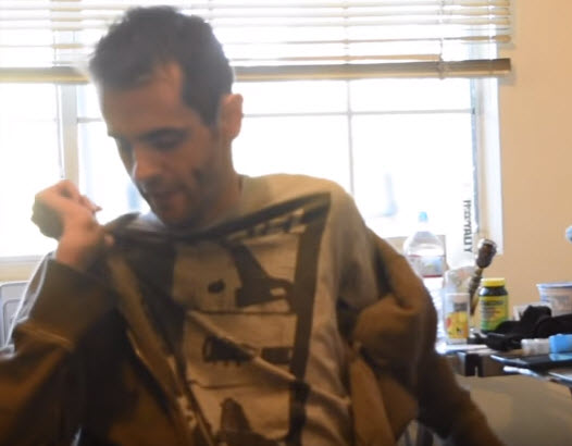 quadriplegic puts on a zip up hoodie