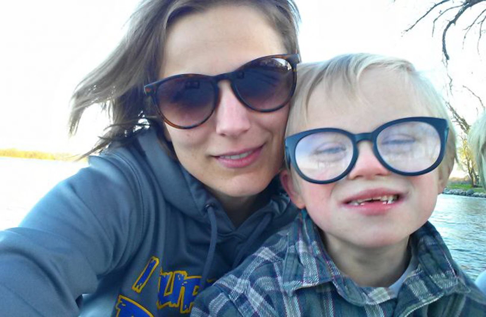 a boy with Down Syndrome and his mom take a selfie