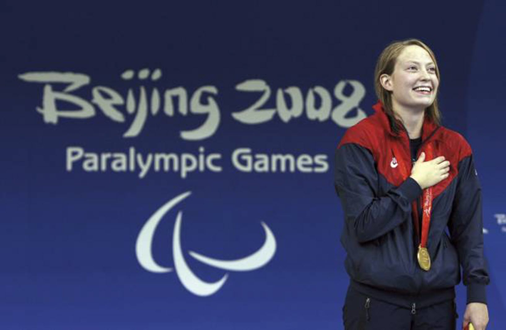 swimmer with cerebral palsy wins a medal at the paralympic games in Beijing