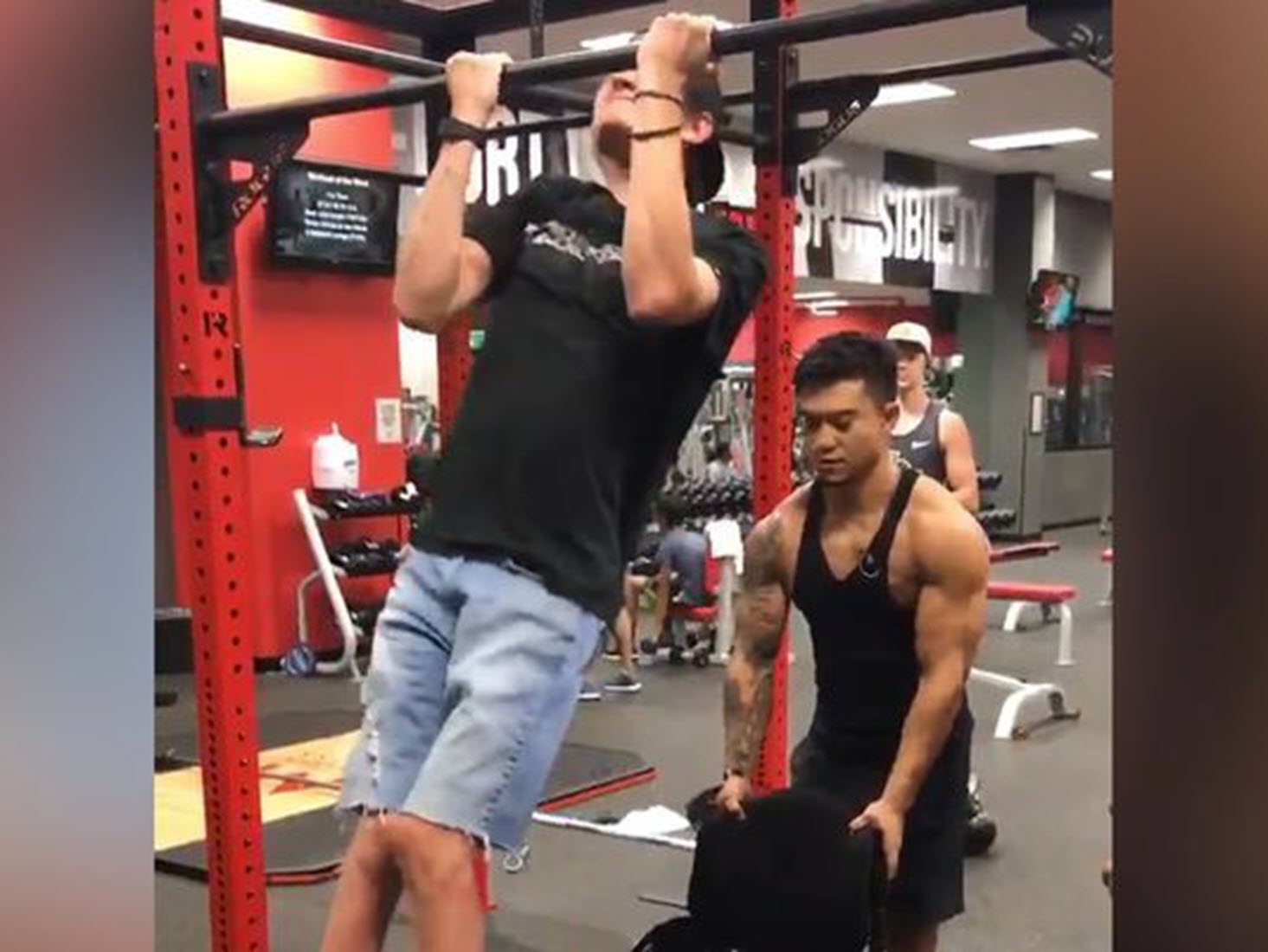 paraplegic teen does pull ups at the gym