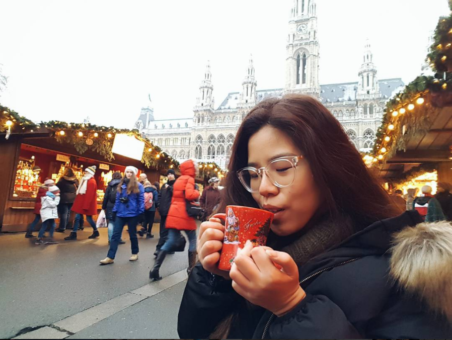 woman sips mulled wine