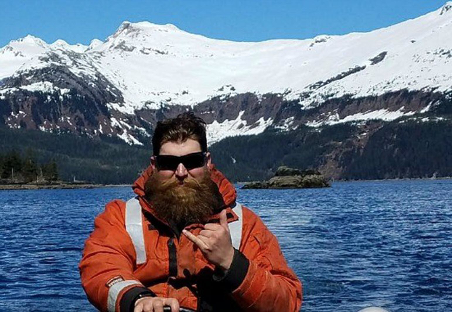paraplegic in front of a snow covered mountain