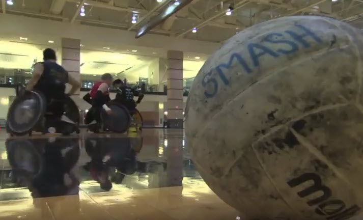 wheelchair rugby players and a ball