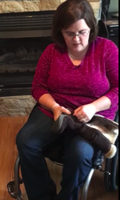 Alicia with fur lined boot in her lap