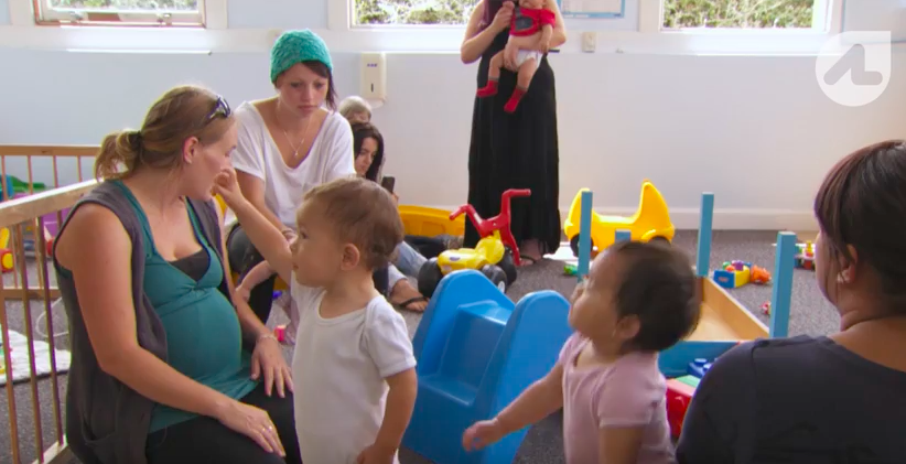 screenshot of AJ helping women