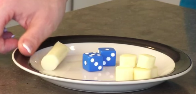 picture of plate with cubed cheese and dice
