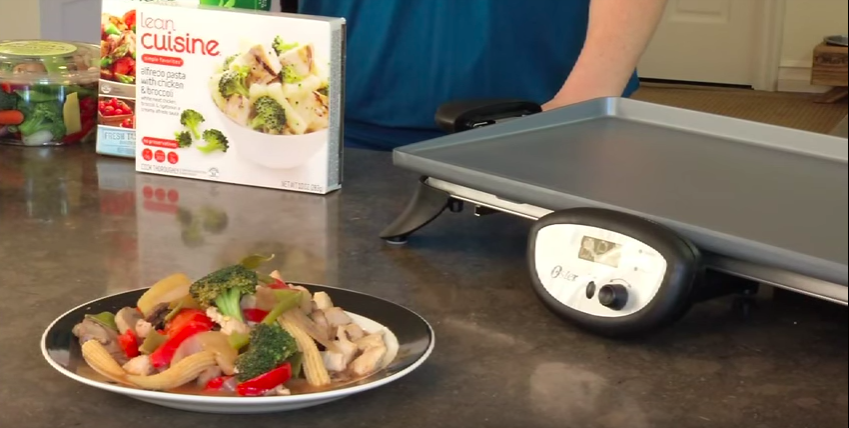 Screenshot of plate of vegetables with electric skillet
