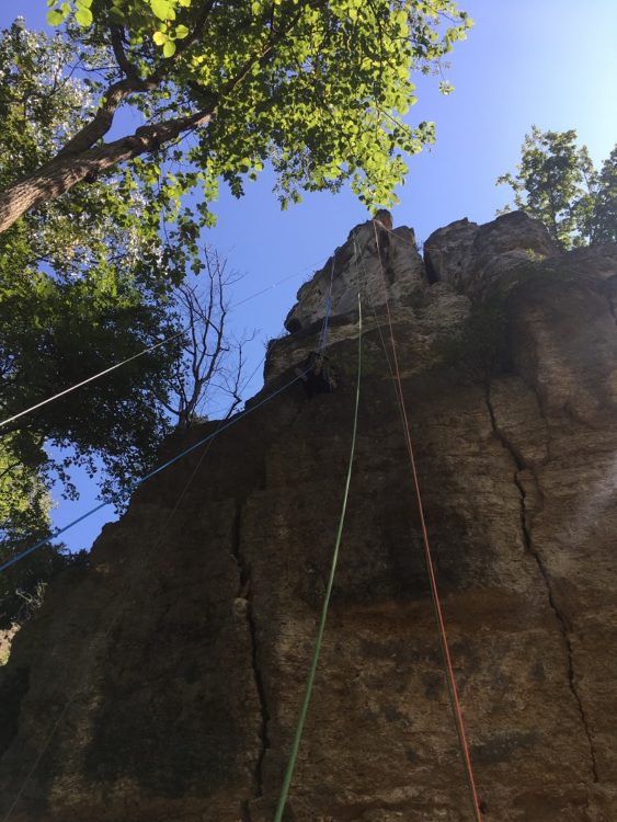 picture of shannon rock climbing on rock wall