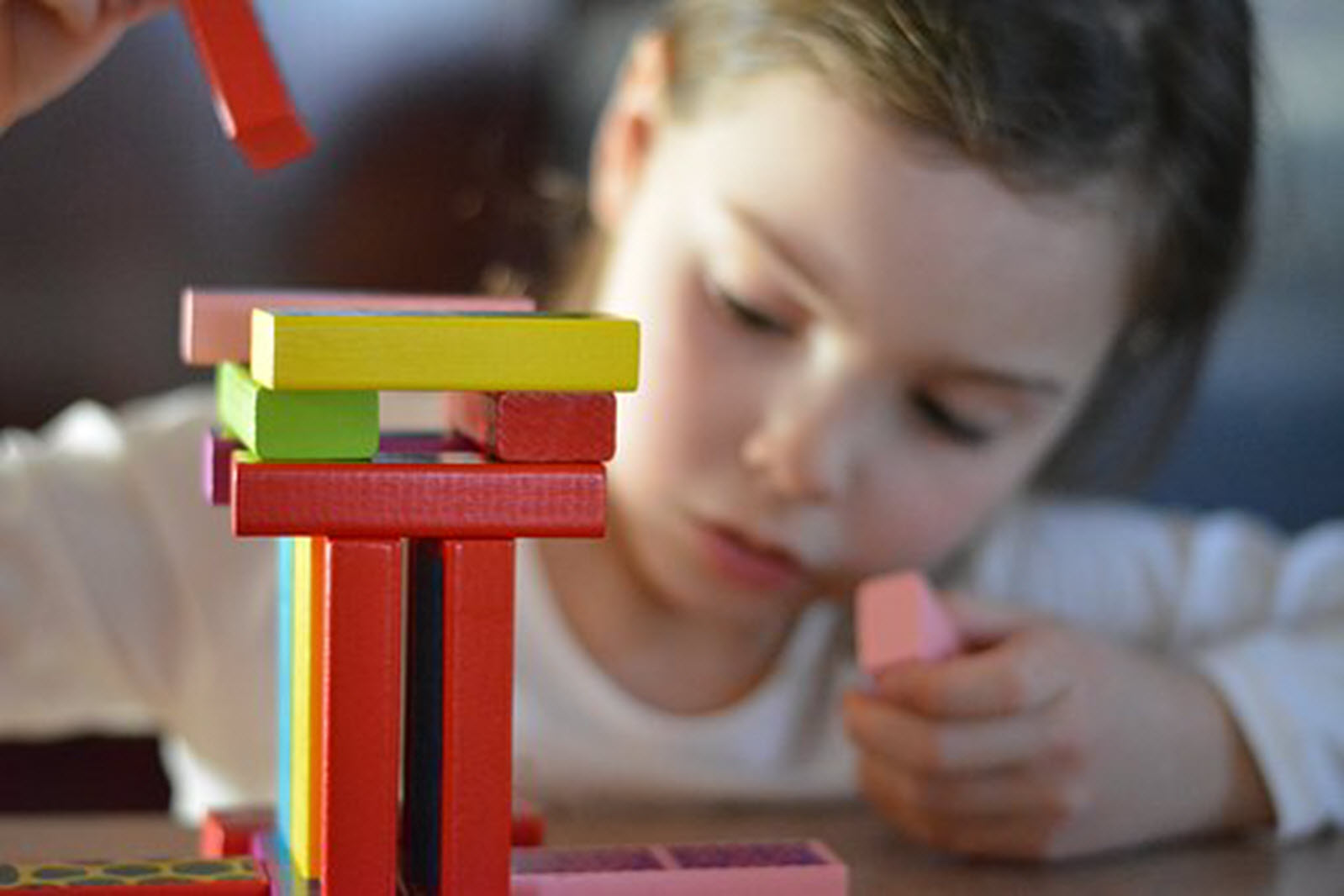 a child plays with blocks