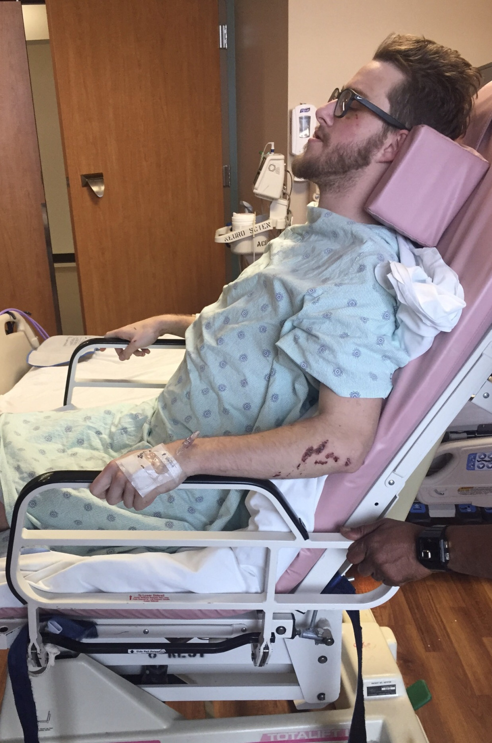 man sits in a chair following a spinal cord injury