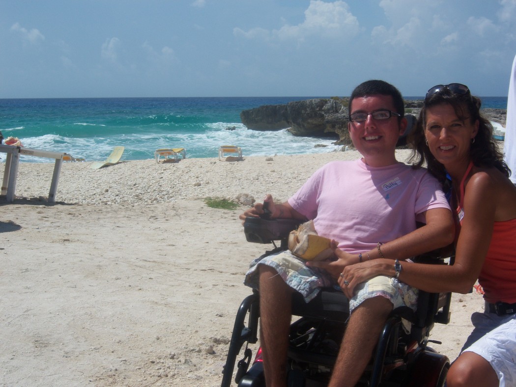 cory and his mom on a beach in cozumel