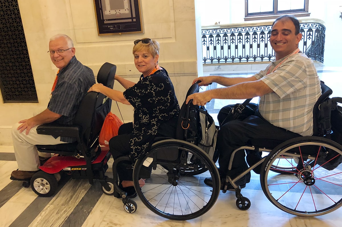 Kim Harrison, her husband Brian, and fellow Georgia advocate Vincenzo Piscopo gained viral fame for this photo and an accompanying video showing Brian’s scooter at the helm of their wheelchair train. “We brought his scooter along to help him get from place to place, as he had back surgery, but at one point we realized we can make our appointments and not feel stressed,” says Kim. “It was fun because people were commenting and we’d yell out, ‘That’s how we roll.’”