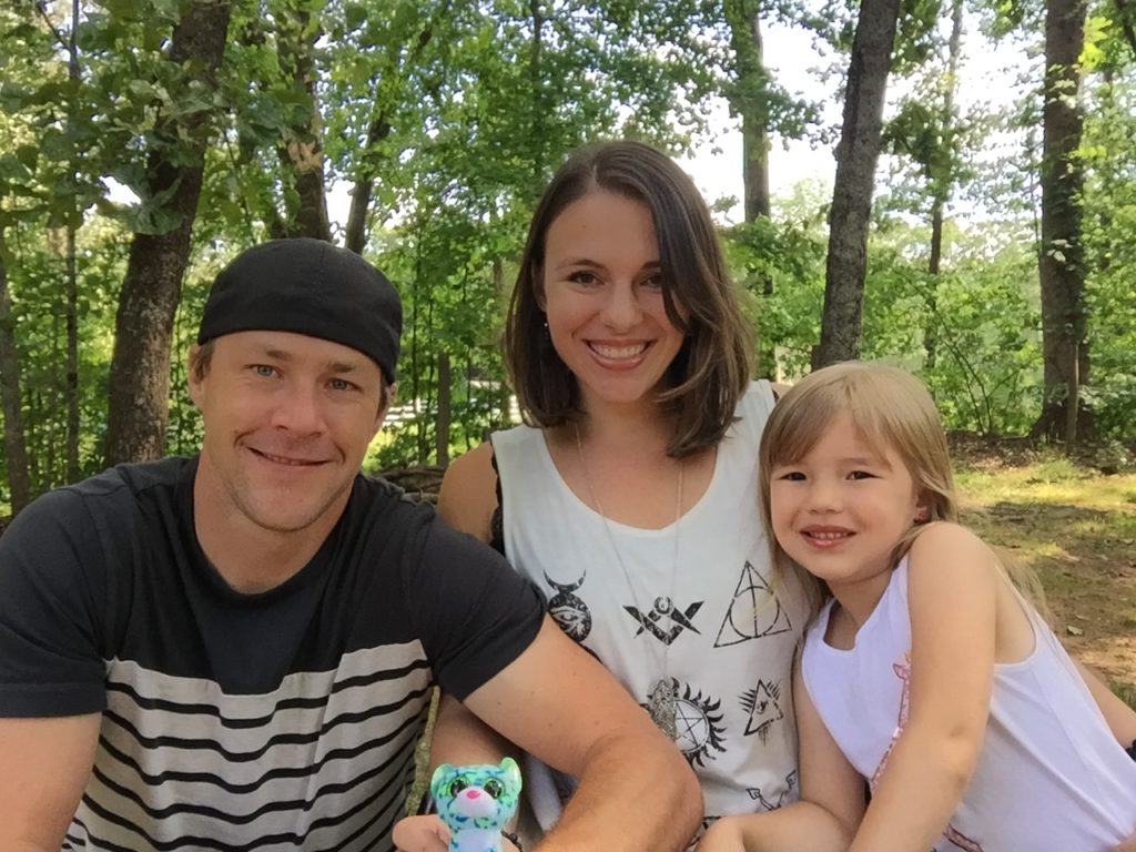 Picture of Kristina, her husband, and her daughter.