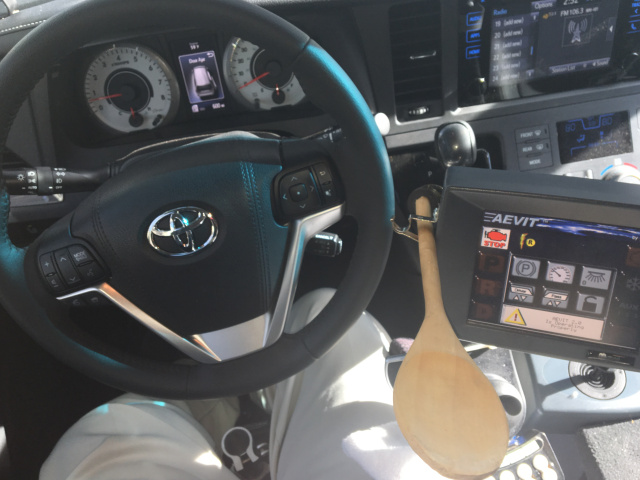 Picture of Alex's steering wheel and driving controls 