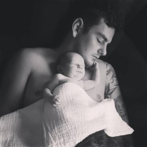 Picture of Shawn with Oliver laying on his chest