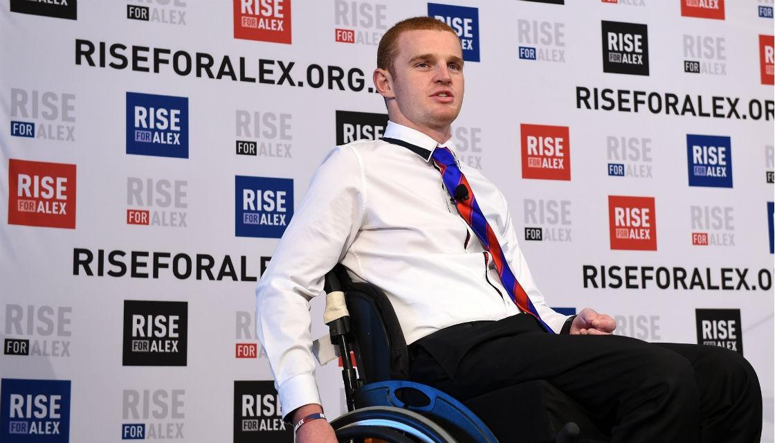 Picture of Alex in wheelchair