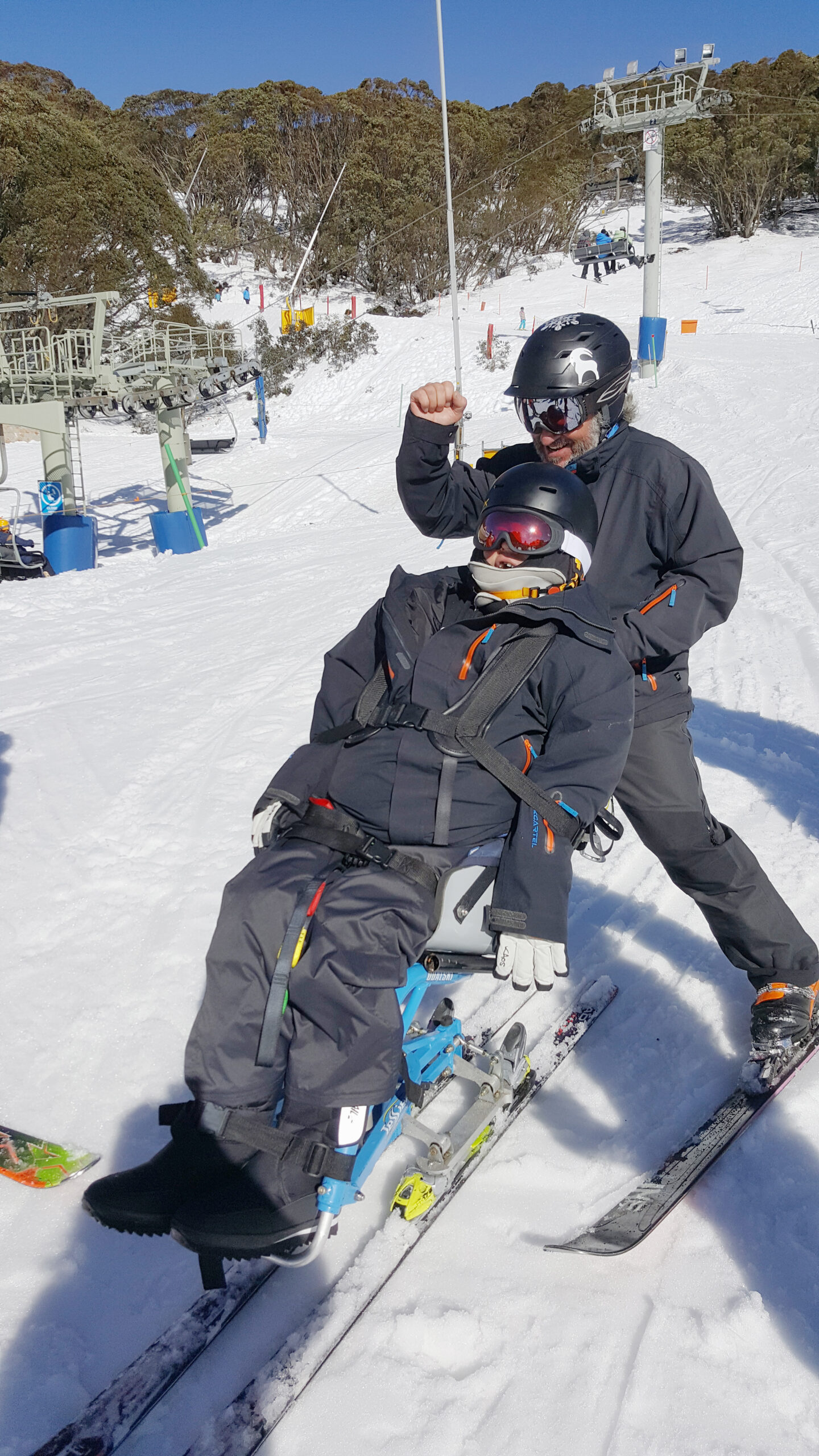 Anthony skiing with instructor 