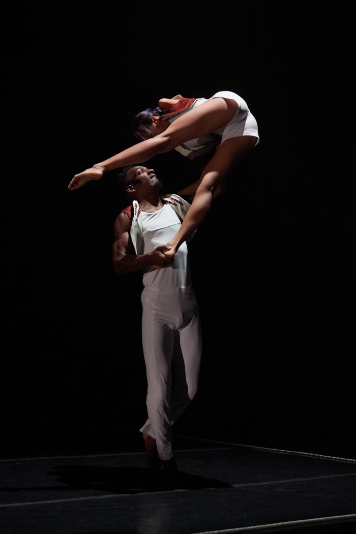 male dancer lifting woman dancer in air