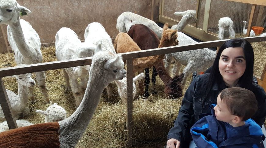 Emma and her nephew with alpacas