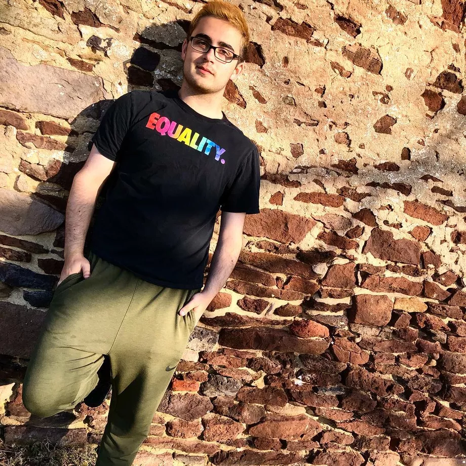 Bennett in a shirt that says EQUALITY in rainbow font
