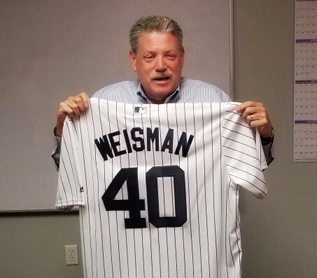 United Spinal staff presented Jim with his very own Yankees jersey to commemorate his 40 years of service to the disability community.