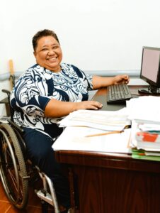 Woman smiling sitting at desk