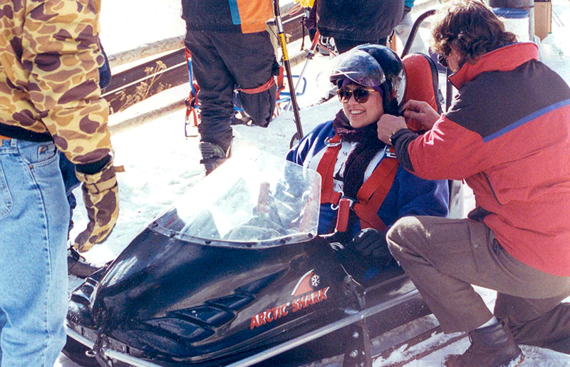 A native of Alaska, Stefanowicz enjoys winter sports. Elaine sitting in a snow mobile.
