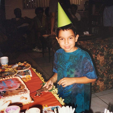 Young David cutting birthday cake
