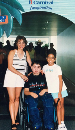 David wheelchair next to mom and sister on a Carnival cruise