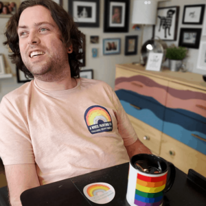 A wheelchair-using man in a T-shirt