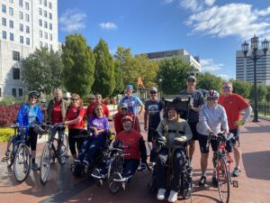 Group shot of wheelchair users and nondisabled bike riders.